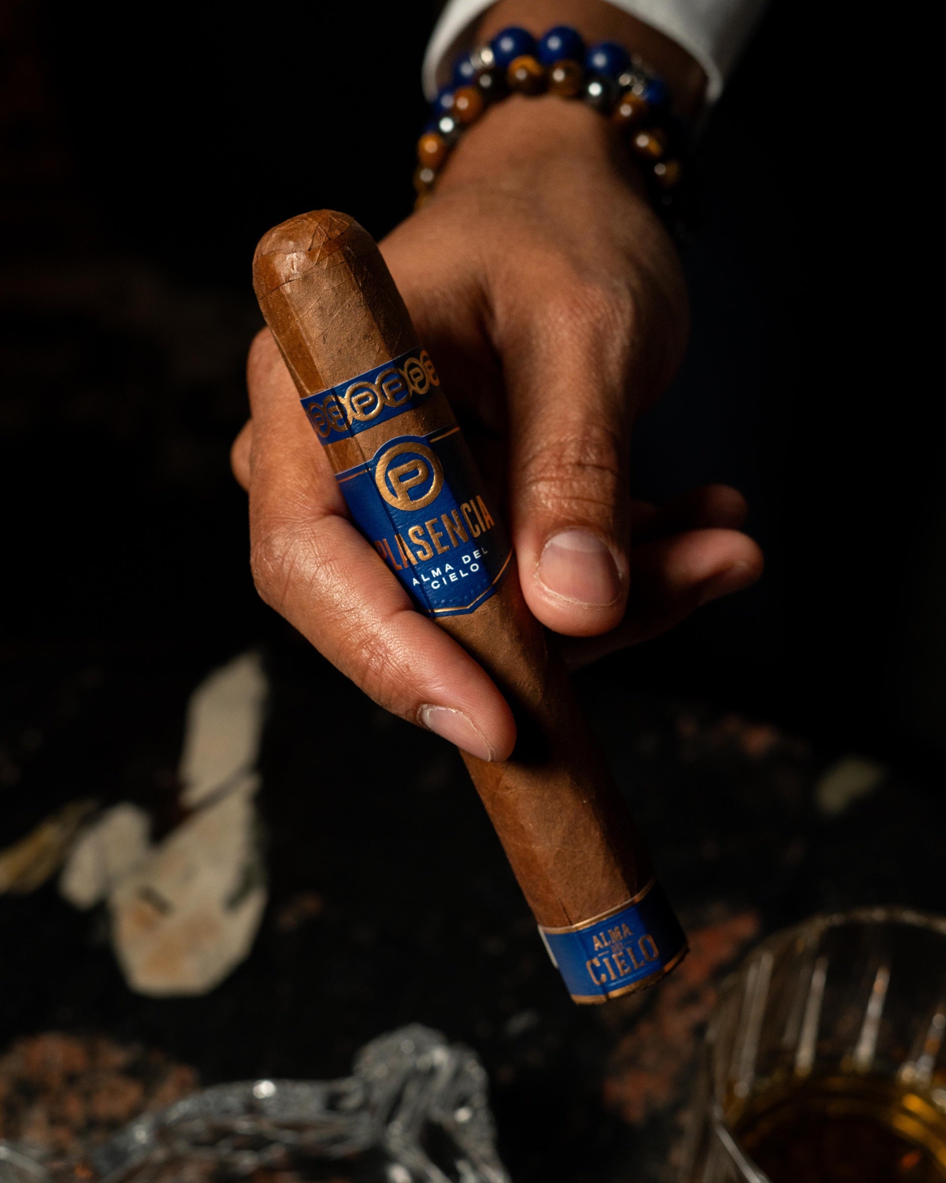 Close-up of a premium cigar from a blue box at Cigar Club Miami